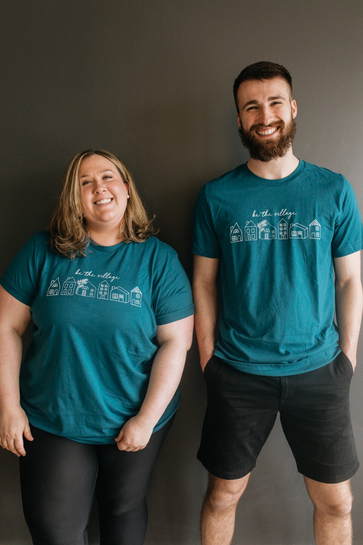 BE THE VILLAGE T-SHIRT - TEAL