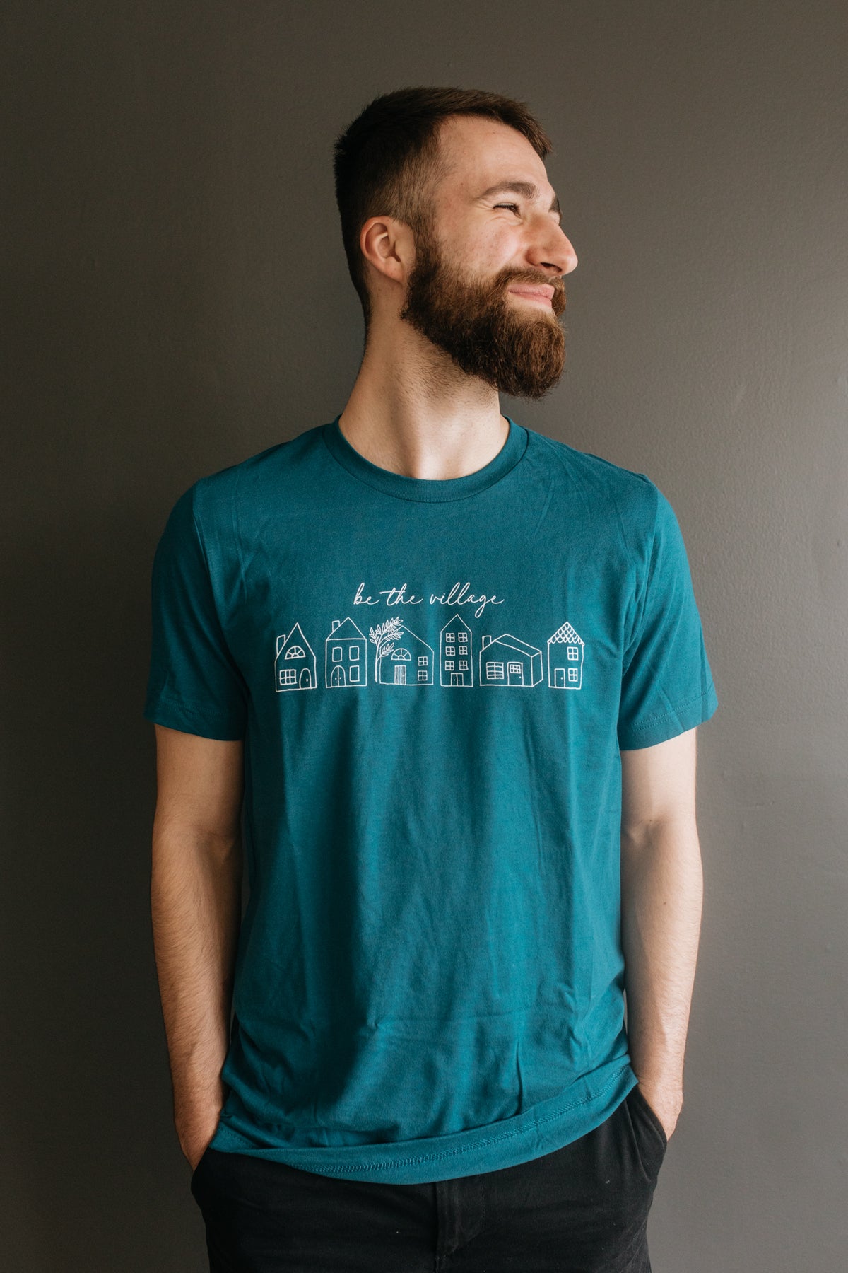 BE THE VILLAGE T-SHIRT - TEAL