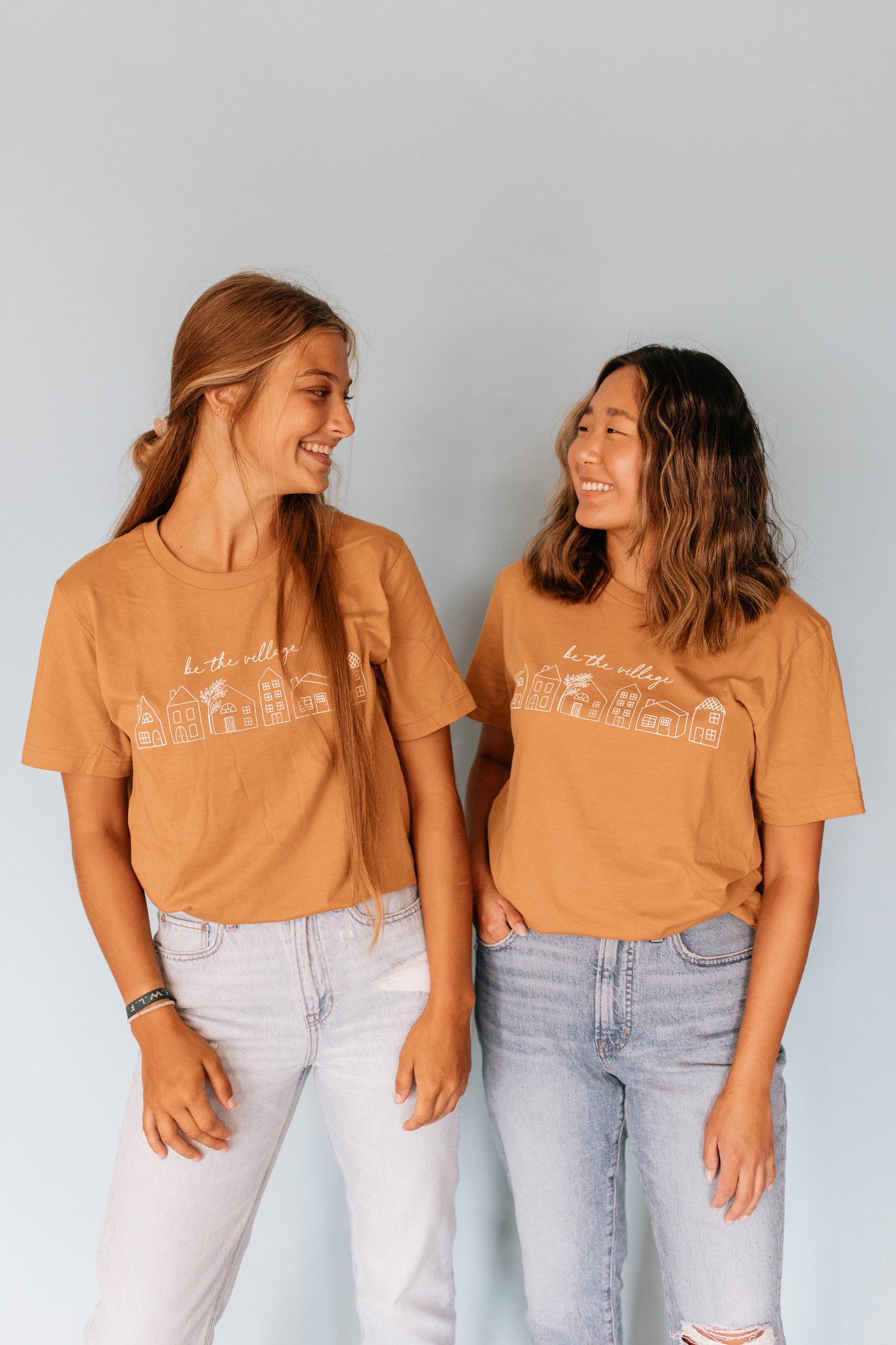 BE THE VILLAGE T-SHIRT - TAN – Goods and Better